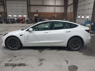 2021 Tesla Model 3 Long Range with VIN 5YJ3E1EBXMF051060, listed as a IAAI auction lot 41958018 with 65,631 mi miles. Bid and sale history available at carsss.com. Image 14.