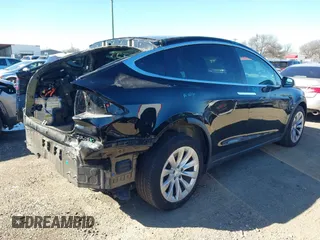 2019 Tesla Model X 75D with VIN 5YJXCDE2XKF161371, listed as a IAAI auction lot 41174741 with 34,979 mi miles. Bid and sale history available at carsss.com. Image 4.