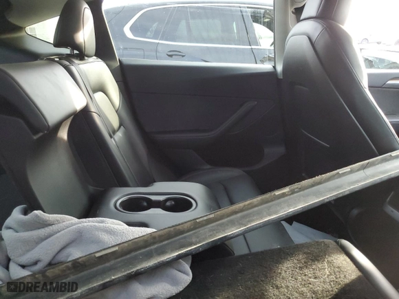 2022 Tesla Model Y Performance with VIN 7SAYGDEFXNF563796, listed as a Copart auction lot 47417875 with 57,884 mi miles and Salvage Title. Bid and sale history available at carsss.com. Image 11.