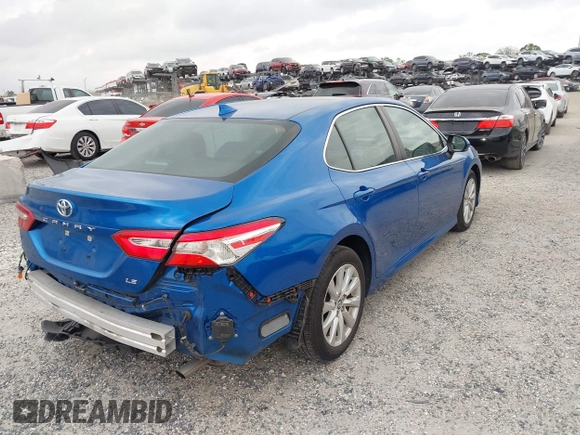 2020 Toyota Camry LE with VIN 4T1L11AK5LU310671, listed as a IAAI auction lot 41732306 with 61,379 mi miles and . Bid and sale history available at carsss.com. Image 4.