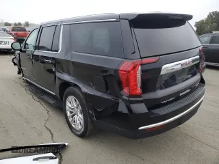 2023 GMC Yukon XL SLT with VIN 1GKS2GKD5PR363433, listed as a Copart auction lot 85979734 with 61,957 mi miles and Salvage Title. Bid and sale history available at DreamBid. Image 2.