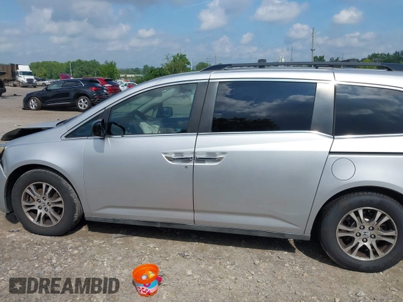 2012 Honda Odyssey EX-L with VIN 5FNRL5H61CB081634, listed as a IAAI auction lot 42760909 with 197,949 mi miles and . Bid and sale history available at DreamBid. Image 15.