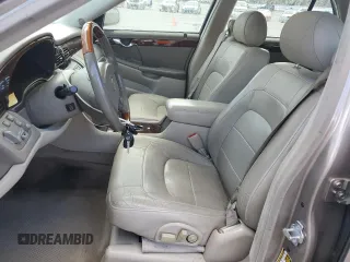 2004 Cadillac DeVille DTS z VIN 1G6KF579X4U212415, wystawiony jako Copart lot #58005555 z przebiegiem 97 663 mil mil oraz Tytuł czysty. Historia ofert i sprzedaży dostępna na DreamBid. Obrazek 7.