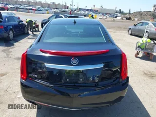 2013 Cadillac XTS Luxury z VIN 2G61P5S30D9220113, wystawiony jako IAAI lot #41970214 z przebiegiem 52 476 mil mil oraz . Historia ofert i sprzedaży dostępna na DreamBid. Obrazek 16.