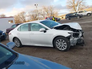 2019 Toyota Camry LE z VIN 4T1B11HK1KU804266, wystawiony jako IAAI lot #41226403 z przebiegiem 91 163 mil mil oraz . Historia ofert i sprzedaży dostępna na DreamBid. Obrazek 14.