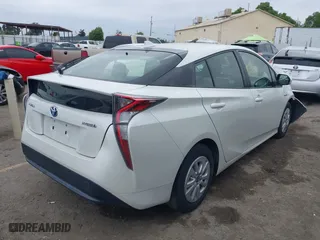 2016 Toyota Prius Two with VIN JTDKBRFU2G3503863, listed as a IAAI auction lot 42035013 with 118,930 mi miles. Bid and sale history available at carsss.com. Image 4.