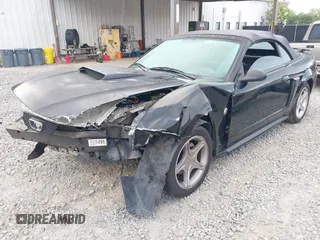 2004 Ford Mustang GT Deluxe z VIN 1FAFP45X64F104911, wystawiony jako IAAI lot #42025366 z przebiegiem 78 686 mil mil oraz . Historia ofert i sprzedaży dostępna na DreamBid. Obrazek 2.