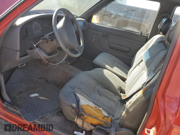 1992 Toyota Pickup DLX z VIN JT4RN93P1N5060207, wystawiony jako Copart lot #82868564 z przebiegiem 231 088 mil mil oraz Szkoda całkowita • Salvage title. Historia ofert i sprzedaży dostępna na DreamBid. Obrazek 7.