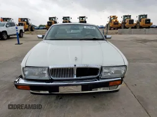 1994 Jaguar XJ with VIN SAJKX1743RC698636, listed as a Copart auction lot 56376685 with 192,928 mi miles and Salvage title. Bid and sale history available at DreamBid. Image 5.