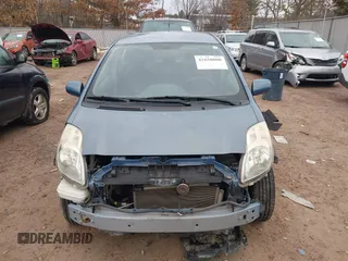 2009 Toyota Yaris with VIN JTDKT903195255240, listed as a IAAI auction lot 41650800 with 168,991 mi miles. Bid and sale history available at carsss.com. Image 12.