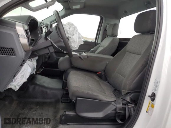 2021 Ford F-150 XL with VIN 1FTMF1EP8MKE68354, listed as a Copart auction lot 84733944 with 97,313 mi miles and Salvage title. Bid and sale history available at DreamBid. Image 7.