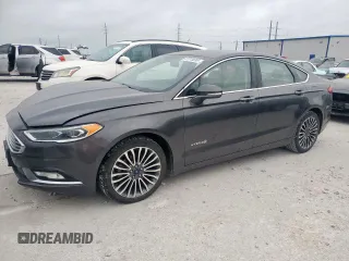 2017 Ford Fusion Hybrid Titanium с VIN 3FA6P0RU7HR388521, выставлен на аукционе Copart как лот 57318895 с пробегом 117 720 миль миль и Списание • Salvage title. История ставок и продаж доступна на DreamBid. Изображение 1.