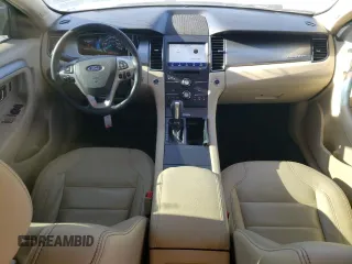 2015 Ford Taurus SEL with VIN 1FAHP2E90FG148821, listed as a Copart auction lot 77557384 with 141,514 mi miles and Salvage Title. Bid and sale history available at DreamBid. Image 8.