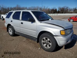 1999 Isuzu Rodeo S with VIN 4S2CK58WXX4373485, listed as a Copart auction lot 87804995 with 246,518 mi miles and Salvage title. Bid and sale history available at DreamBid. Image 4.