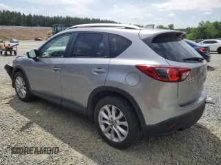 2014 Mazda CX-5 Grand Touring with VIN JM3KE4DY9E0416967, listed as a Copart auction lot 54215285 with 77,296 mi miles and Salvage Title. Bid and sale history available at DreamBid. Image 2.