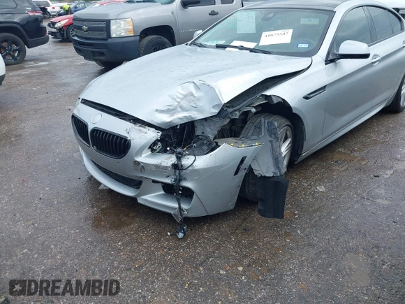 2015 BMW 6 Series 640i z VIN WBA6A0C51FD318982, wystawiony jako IAAI lot #41875547 z przebiegiem 60 968 mil mil oraz . Historia ofert i sprzedaży dostępna na DreamBid. Obrazek 21.
