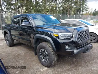 2021 Toyota Tacoma SR z VIN 3TMCZ5AN5MM438543, wystawiony jako IAAI lot #42018501 z przebiegiem 84 898 mil mil oraz . Historia ofert i sprzedaży dostępna na DreamBid. Obrazek 1.