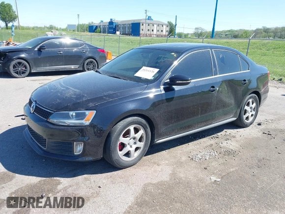 2014 Volkswagen Jetta GLI with VIN 3VW4T7AJ5EM382195, listed as a IAAI auction lot 39211126 with 94,735 mi miles and . Bid and sale history available at DreamBid. Image 2.