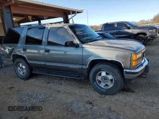 1999 GMC Yukon with VIN 1GKEK13R3XJ750307, listed as a Copart auction lot 84728104 with 212,879 mi miles and Salvage Title. Bid and sale history available at carsss.com. Image 4.