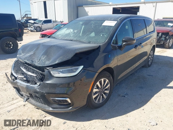 2023 Chrysler Pacifica Hybrid Touring L with VIN 2C4RC1L75PR611901, listed as a IAAI auction lot 41510935 with 44,156 mi miles and . Bid and sale history available at DreamBid. Image 2.