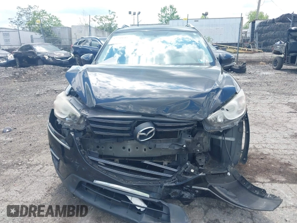 2016 Mazda CX-5 Sport with VIN JM3KE4BY2G0796577, listed as a IAAI auction lot 42230645 with 103,223 mi miles and . Bid and sale history available at DreamBid. Image 11.