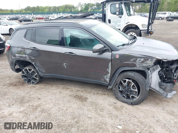 2020 Jeep Compass Trailhawk with VIN 3C4NJDDB3LT200268, listed as a IAAI auction lot 42250192 with 73,804 mi miles and . Bid and sale history available at DreamBid. Image 6.