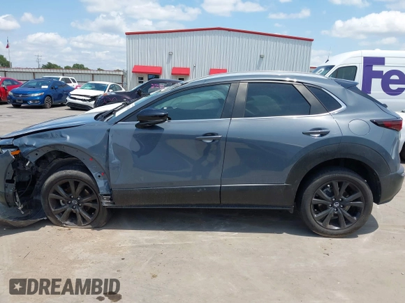 2022 Mazda CX-30 S Carbon Edition with VIN 3MVDMBCL6NM410330, listed as a IAAI auction lot 42107426 with 30,277 mi miles and . Bid and sale history available at DreamBid. Image 15.