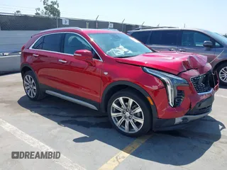 2021 Cadillac XT4 FWD Premium Luxury z VIN 1GYFZCR48MF004849, wystawiony jako IAAI lot #42131896 z przebiegiem 9864 mil mil oraz . Historia ofert i sprzedaży dostępna na DreamBid. Obrazek 1.