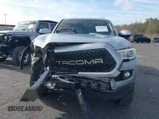 2018 Toyota Tacoma SR5 with VIN 5TFAZ5CN6JX057889, listed as a IAAI auction lot 41449604 with 114,888 mi miles and . Bid and sale history available at DreamBid. Image 12.