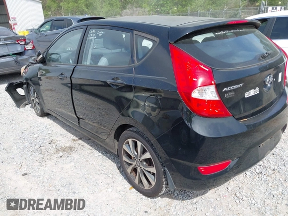 2015 Hyundai Accent Sport with VIN KMHCU5AE5FU233054, listed as a IAAI auction lot 41932298 with 70,278 mi miles. Bid and sale history available at carsss.com. Image 3.