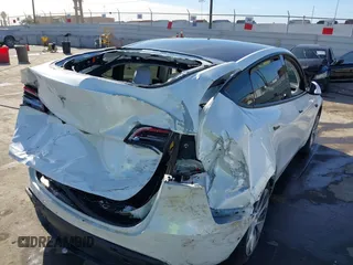 2021 Tesla Model Y Standard Range z VIN 5YJYGDED4MF162982, wystawiony jako IAAI lot #41378674 z przebiegiem 60 267 mil mil oraz . Historia ofert i sprzedaży dostępna na DreamBid. Obrazek 6.