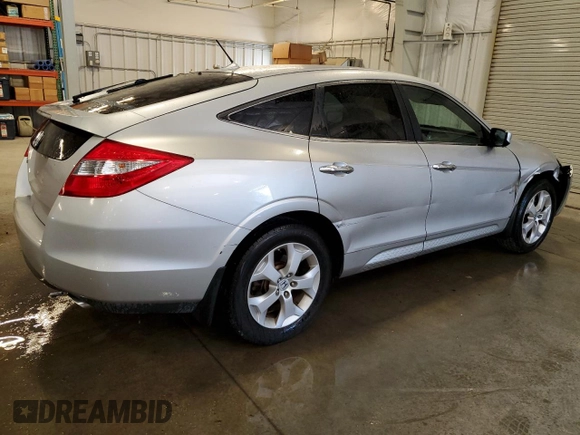 2010 Honda Crosstour EX-L z VIN 5J6TF1H50AL010880, wystawiony jako Copart lot #55805665 z przebiegiem 116 323 mil mil oraz Szkody całkowita. Historia ofert i sprzedaży dostępna na DreamBid. Obrazek 3.