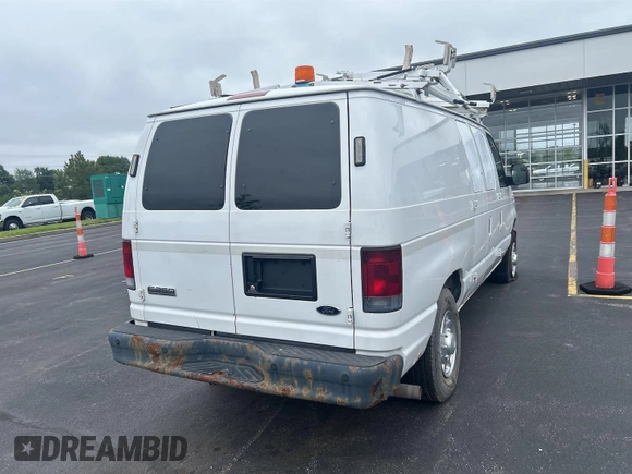 2010 Ford Econoline Cargo Commercial with VIN 1FTNE2EL2ADA74603, listed as a IAAI auction lot 42566243 with 161,715 mi miles and . Bid and sale history available at DreamBid. Image 1.