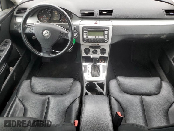 2009 Volkswagen Passat z VIN WVWXK73C39E138994, wystawiony jako Copart lot #70876274 z przebiegiem 118 057 mil mil oraz Czysty tytuł • Clean title. Historia ofert i sprzedaży dostępna na DreamBid. Obrazek 8.