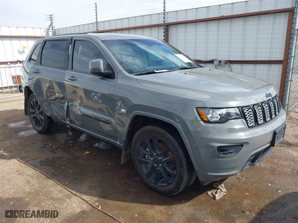 2021 Jeep Grand Cherokee Laredo X with VIN 1C4RJEAG5MC824738, listed as a IAAI auction lot 41580995 with 57,923 mi miles. Bid and sale history available at carsss.com. Image 1.