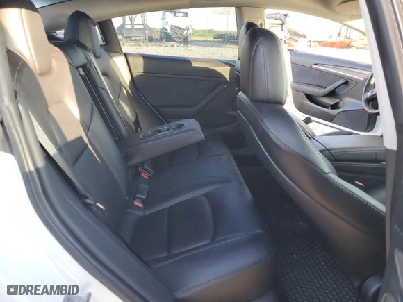 2021 Tesla Model 3 Standard Range Plus with VIN 5YJ3E1EA9MF100403, listed as a Copart auction lot 48561545 with 68,996 mi miles and Salvage Title. Bid and sale history available at carsss.com. Image 10.