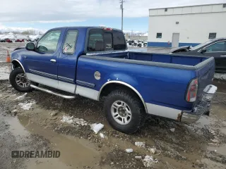 1997 Ford F-150 XL with VIN 1FTEX17LXVKB44786, listed as a Copart auction lot 49630955 with 301,736 mi miles and Salvage title. Bid and sale history available at DreamBid. Image 2.