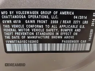2014 Volkswagen Passat SE z VIN 1VWBT7A31EC102802, wystawiony jako IAAI lot #41344543 z przebiegiem 106 758 mil mil oraz . Historia ofert i sprzedaży dostępna na DreamBid. Obrazek 9.