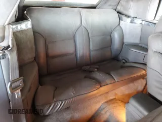 1990 Chrysler LeBaron z VIN 1C3XJ45J9LG405682, wystawiony jako Copart lot #48690985 z przebiegiem 75 714 mil mil oraz Tytuł czysty. Historia ofert i sprzedaży dostępna na DreamBid. Obrazek 10.