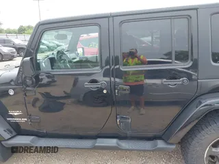 2014 Jeep Wrangler Unlimited Sahara with VIN 1C4HJWEG8EL292835, listed as a IAAI auction lot 42705672 with 176,769 mi miles and . Bid and sale history available at DreamBid. Image 15.