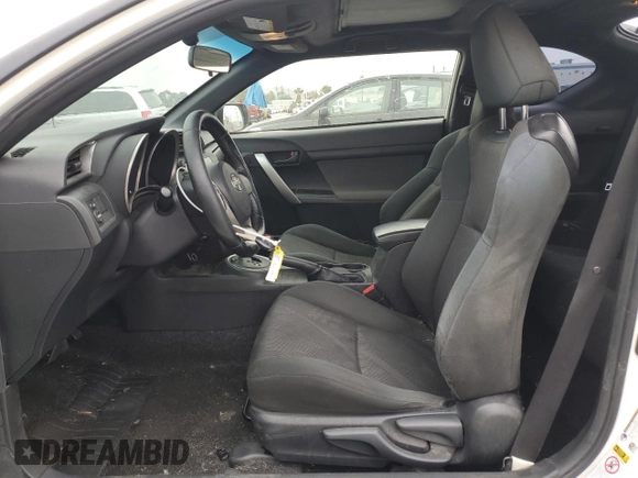 2013 Scion tC z VIN JTKJF5C77D3056779, wystawiony jako Copart lot #57459935 z przebiegiem 157 420 mil mil oraz Szkoda całkowita • Salvage title. Historia ofert i sprzedaży dostępna na DreamBid. Obrazek 7.