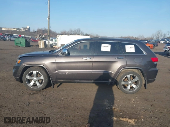 2015 Jeep Grand Cherokee Overland with VIN 1C4RJFCT3FC725239, listed as a IAAI auction lot 41779555 with 100,837 mi miles. Bid and sale history available at carsss.com. Image 14.