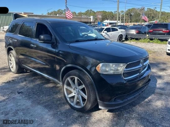 2013 Dodge Durango Crew with VIN 1C4SDHDT1DC697618, listed as a Copart auction lot 88926165 with 128,218 mi miles and Clean Title. Bid and sale history available at carsss.com. Image 1.