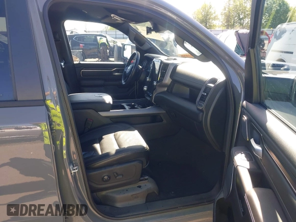 2023 Ram 1500 Rebel with VIN 1C6SRFLT2PN677577, listed as a IAAI auction lot 41991668 with 20,507 mi miles and . Bid and sale history available at DreamBid. Image 5.