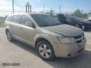 2009 Dodge Journey SXT with VIN 3D4GG57VX9T196136, listed as a IAAI auction lot 42034751 with 129,537 mi miles. Bid and sale history available at carsss.com. Image 1.
