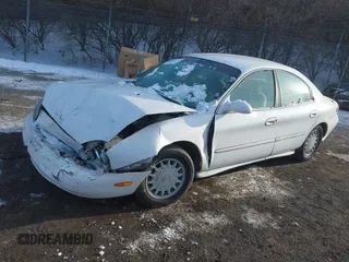 1997 Mercury Sable GS z VIN 1MELM50U6VA657452, wystawiony jako IAAI lot #41415751 z przebiegiem 185 235 mil mil oraz . Historia ofert i sprzedaży dostępna na DreamBid. Obrazek 2.