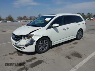 2016 Honda Odyssey Touring Elite with VIN 5FNRL5H97GB044278, listed as a IAAI auction lot 42056101 with 182,396 mi miles and . Bid and sale history available at DreamBid. Image 2.