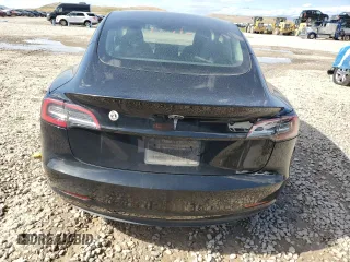 2023 Tesla Model 3 with VIN 5YJ3E1EAXPF708001, listed as a Copart auction lot 57252735 with 71,579 mi miles and Salvage title. Bid and sale history available at DreamBid. Image 6.
