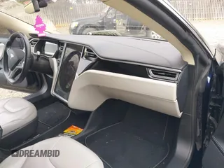 2014 Tesla Model S 60 with VIN 5YJSA1S12EFP42605, listed as a IAAI auction lot 40905031 with 68,155 mi miles and . Bid and sale history available at DreamBid. Image 5.