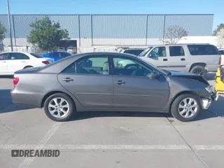 2005 Toyota Camry LE with VIN 4T1BF30K55U619313, listed as a IAAI auction lot 41854001 with 89,982 mi miles and . Bid and sale history available at DreamBid. Image 14.